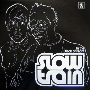 SLOW TRAIN – In The Black Of Night