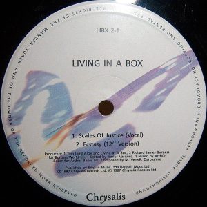 LIVING IN A BOX – Scales Of Justice
